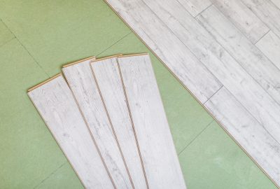laminated flooring boards on gray background